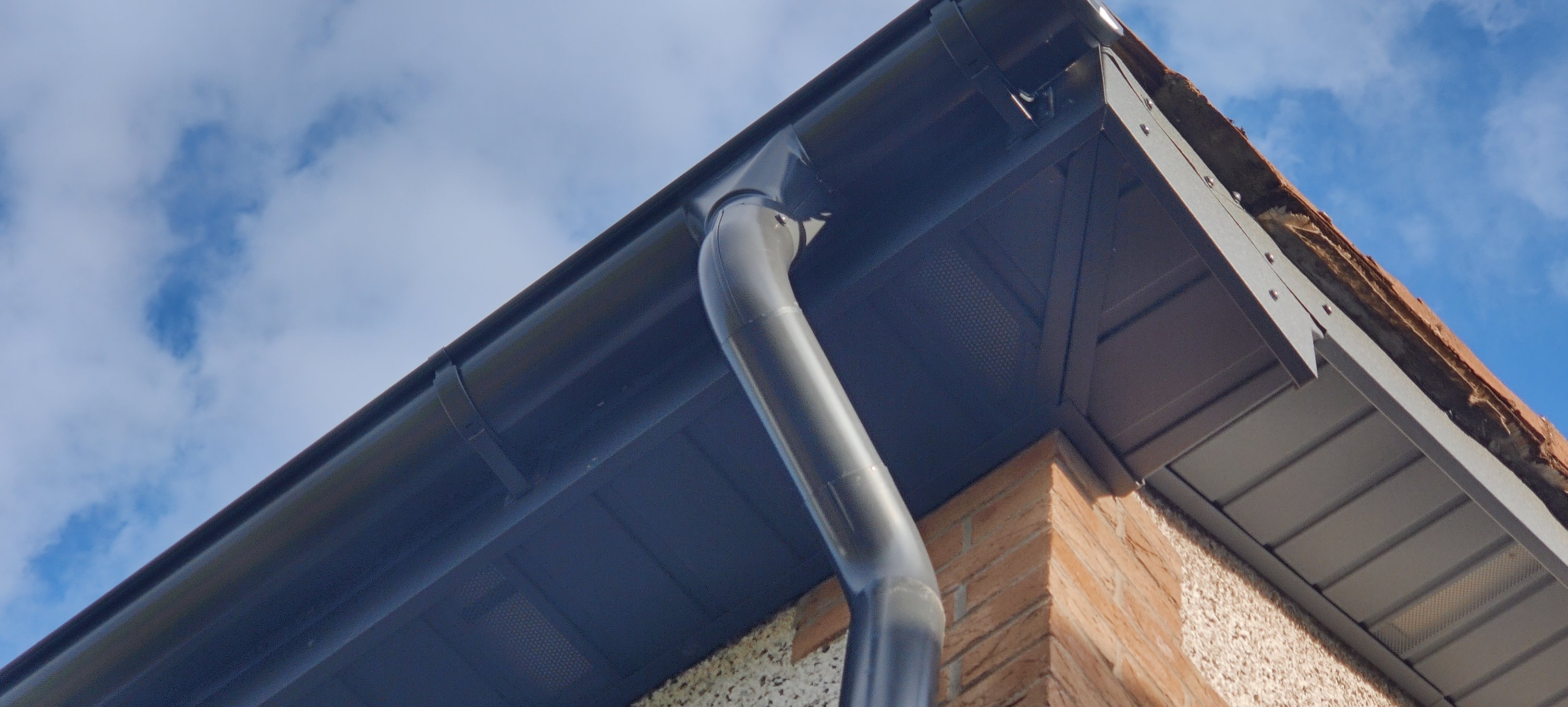 Steel soffit and guttering detail on a completed home